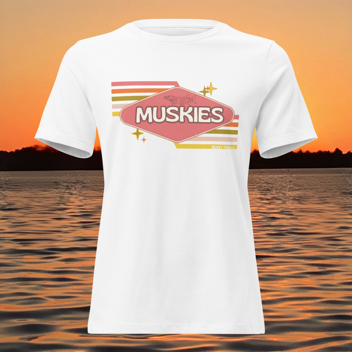 Retro Muskie Sign t-shirt featuring vintage pink and yellow badge graphic with musky fish illustration, lake sunset background