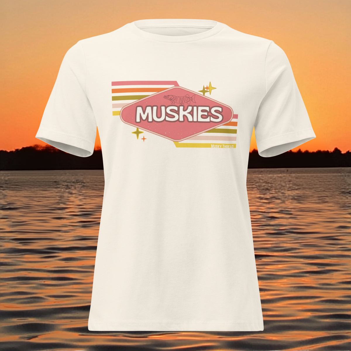 Retro Muskie Sign t-shirt featuring vintage pink and yellow badge graphic with musky fish illustration, lake sunset background