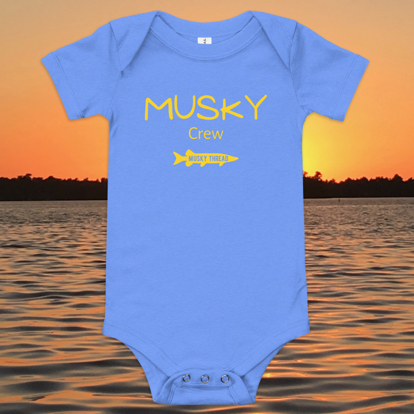 baby onesie with musky crew fishing design yellow text musky thread logo sunset lake background