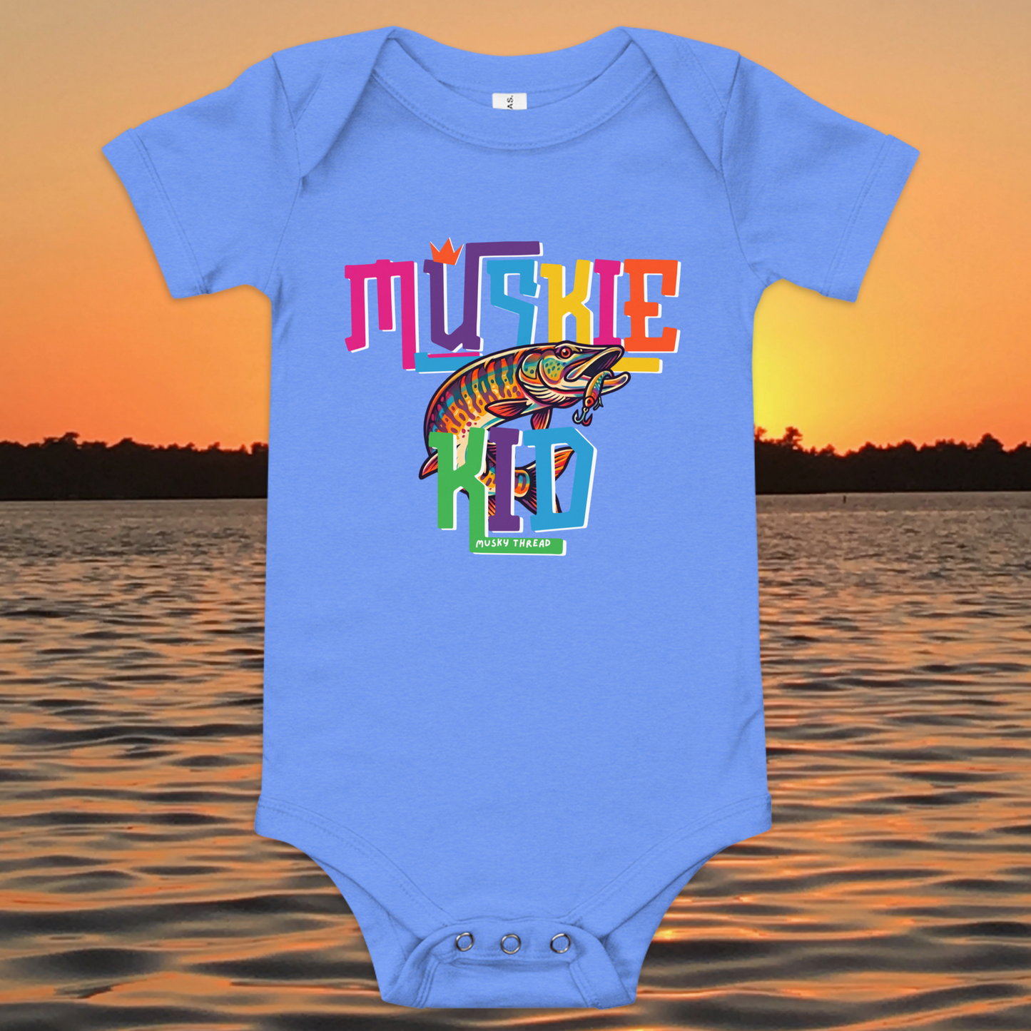 Baby short-sleeve onesie with colorful Muskie Kid street-design graphic featuring a jumping musky fish