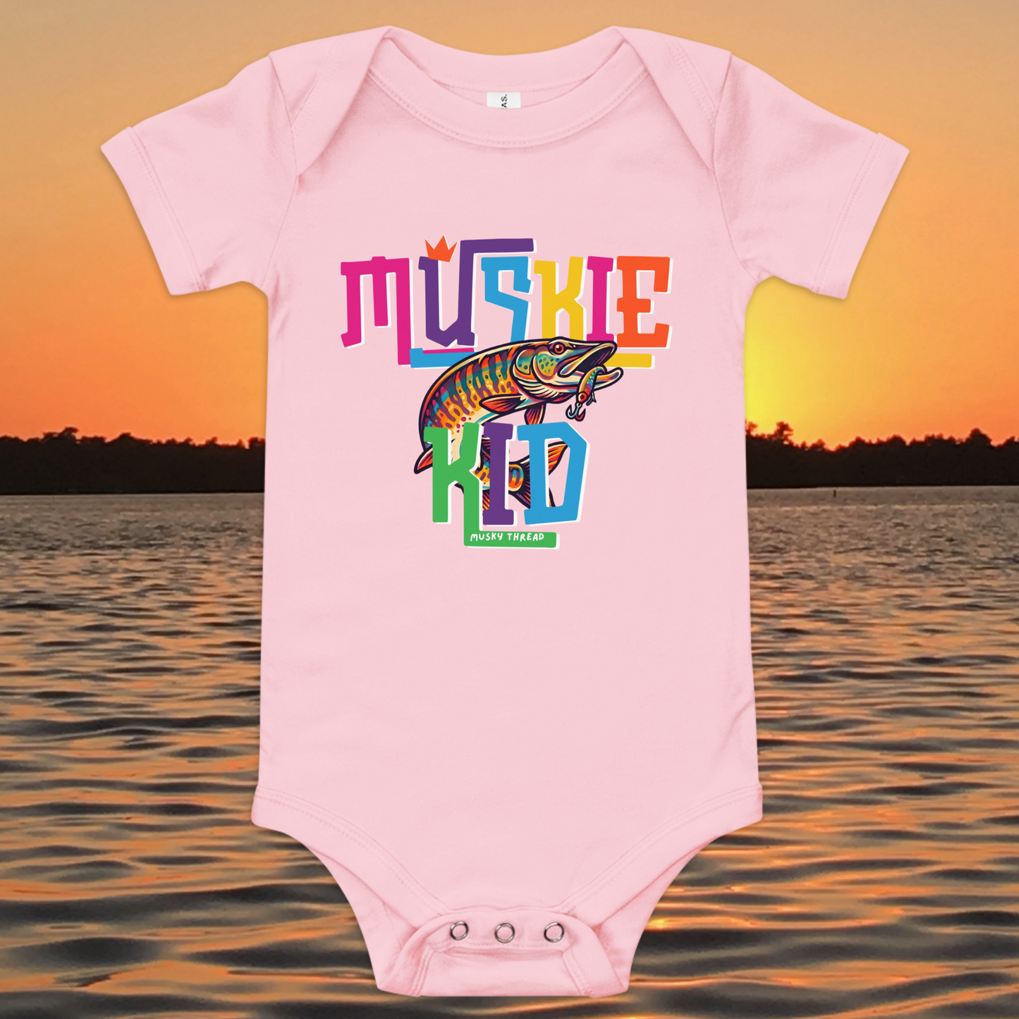 Baby short-sleeve onesie with colorful Muskie Kid street-design graphic featuring a jumping musky fish