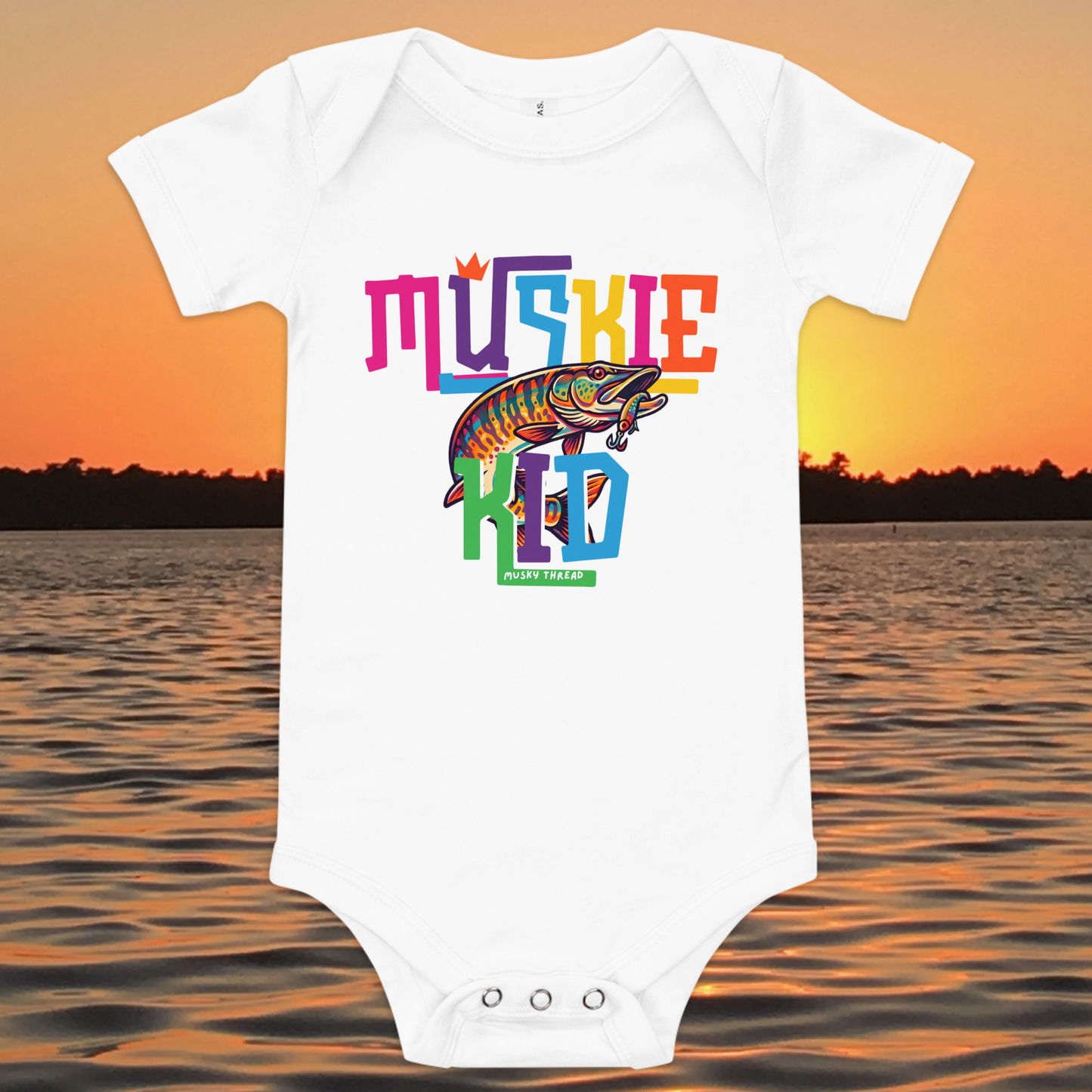 Baby short-sleeve onesie with colorful Muskie Kid street-design graphic featuring a jumping musky fish