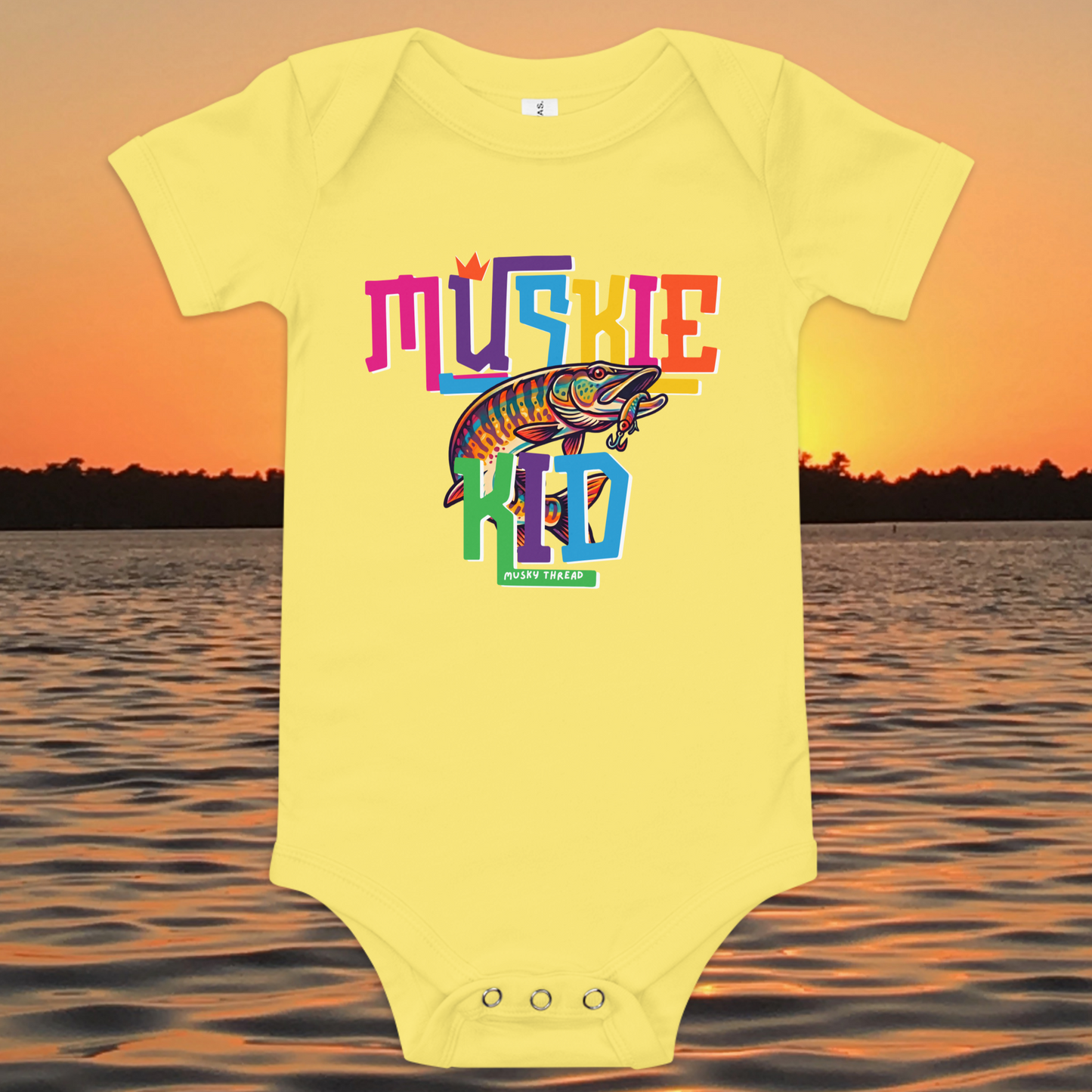 Baby short-sleeve onesie with colorful Muskie Kid street-design graphic featuring a jumping musky fish