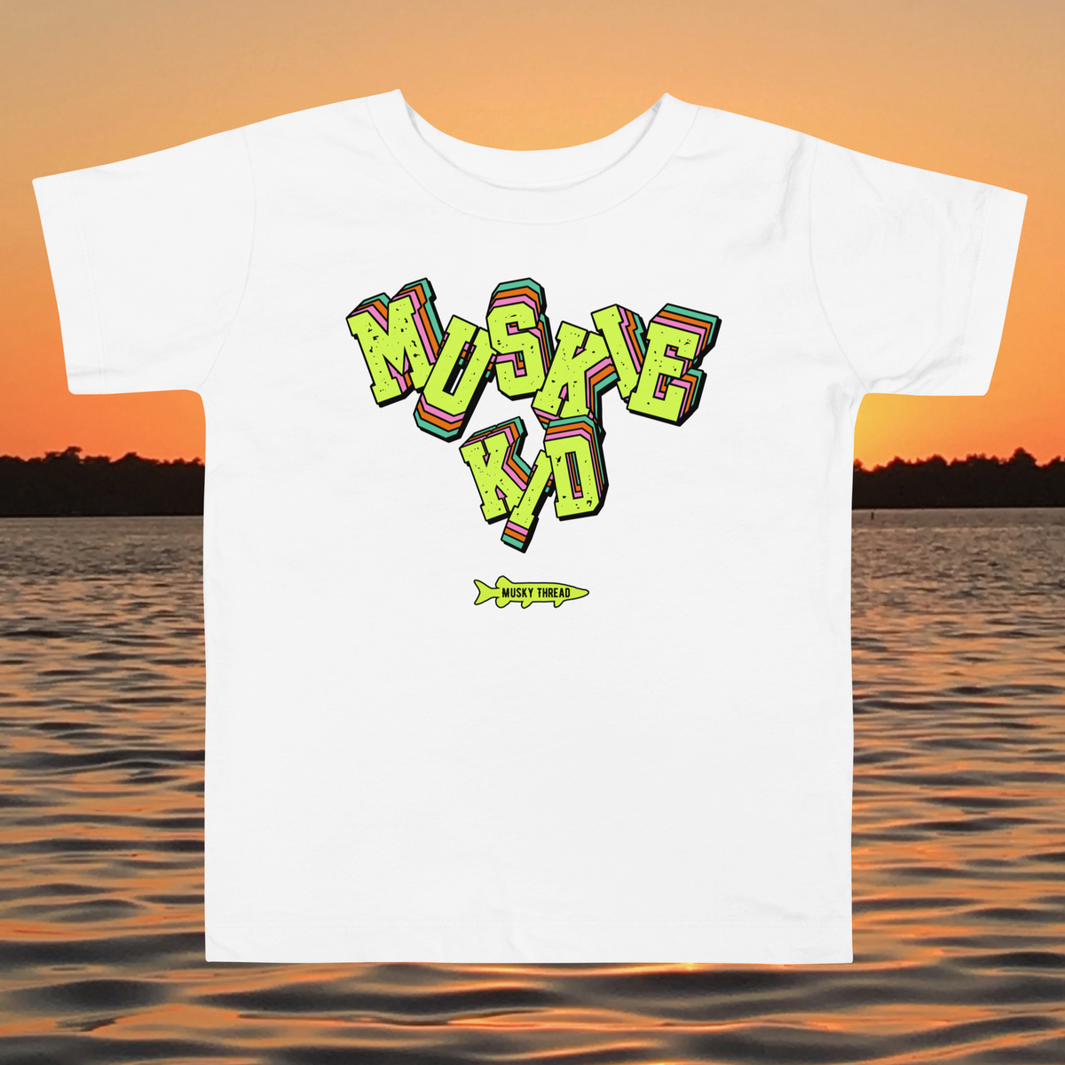 toddler t-shirt with neon green, pink, and teal "Muskie Kid" retro graphic and Musky Thread fish logo, shown against a lake sunset background
