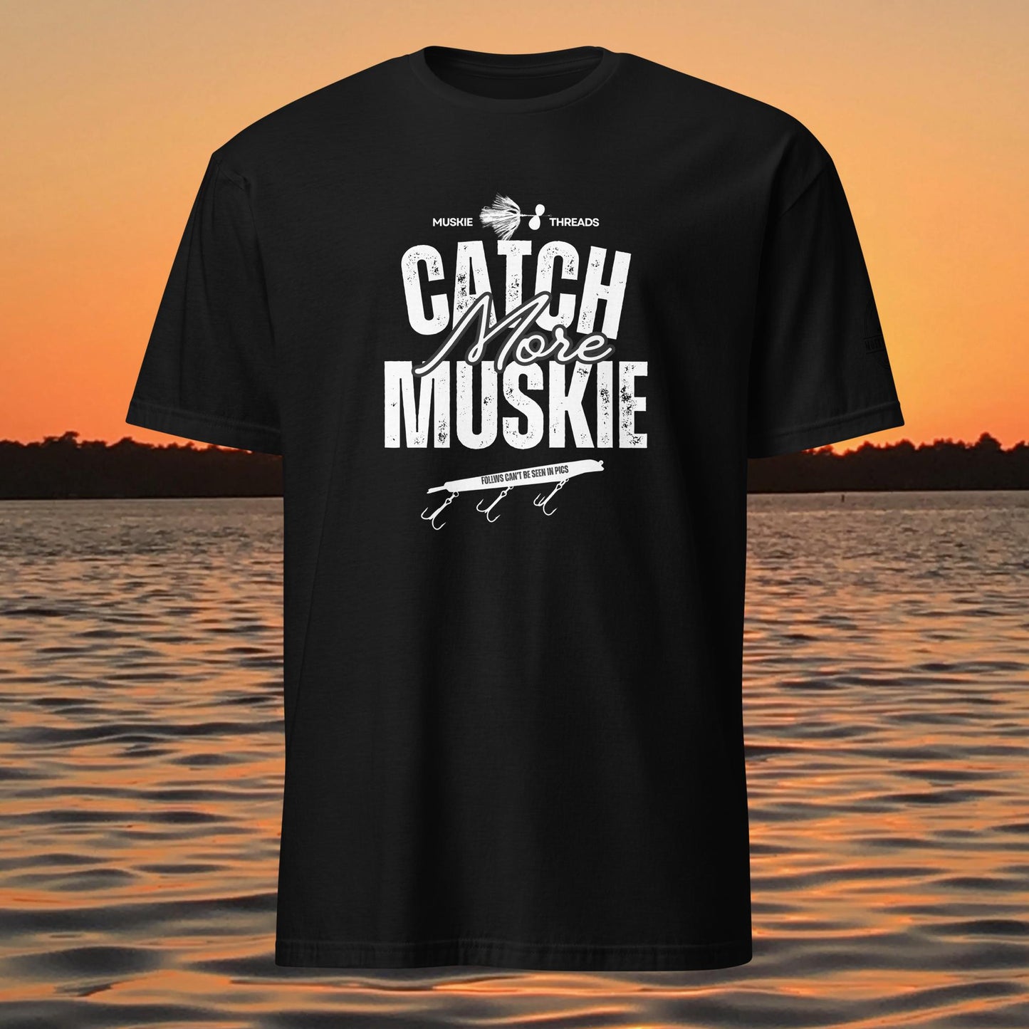 Catch More Muskie t-shirt with fishing lure graphic and “follows can’t be seen in pics” text on black shirt