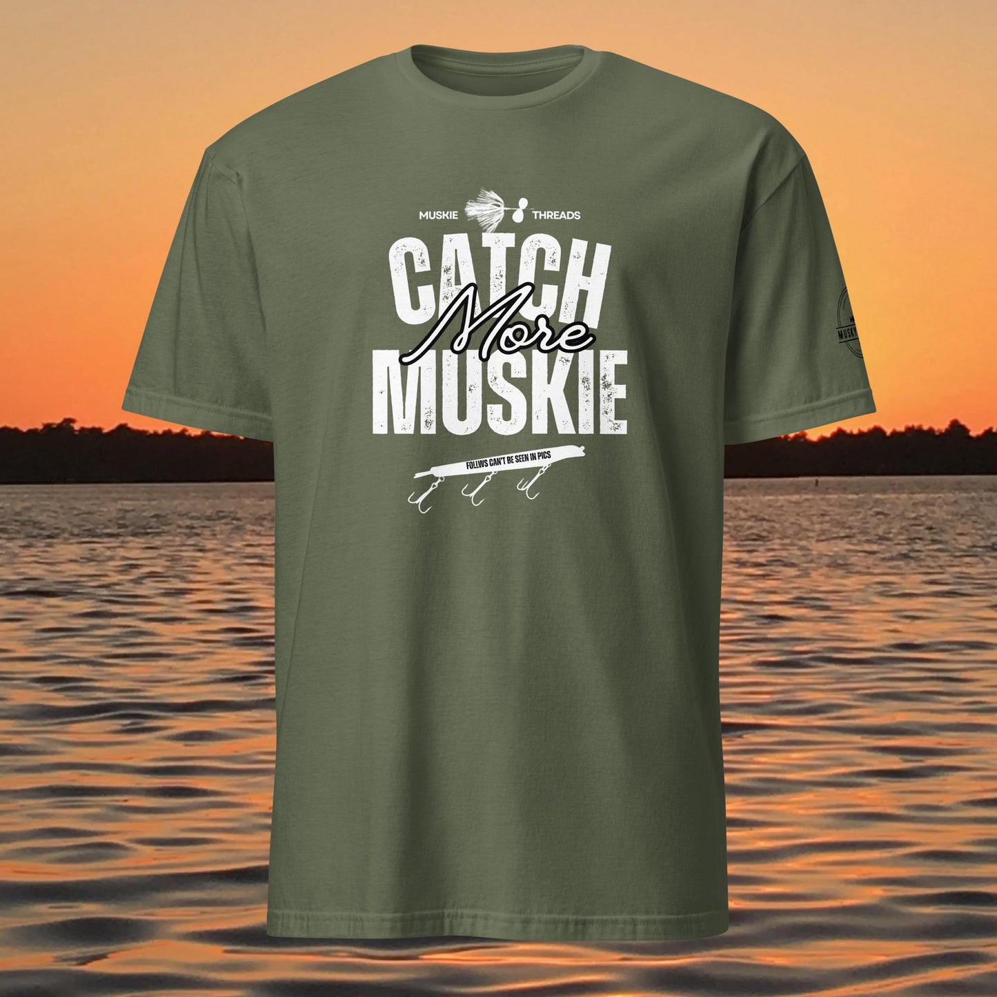 Catch More Muskie t-shirt with fishing lure graphic and “follows can’t be seen in pics” text on green shirt