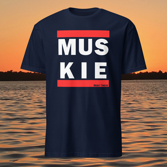 Muskie fishing t-shirt front view with bold red and white lettering
Close-up of MUSKIE text design on black t-shirt
Model wearing black muskie fishing t-shirt outdoors