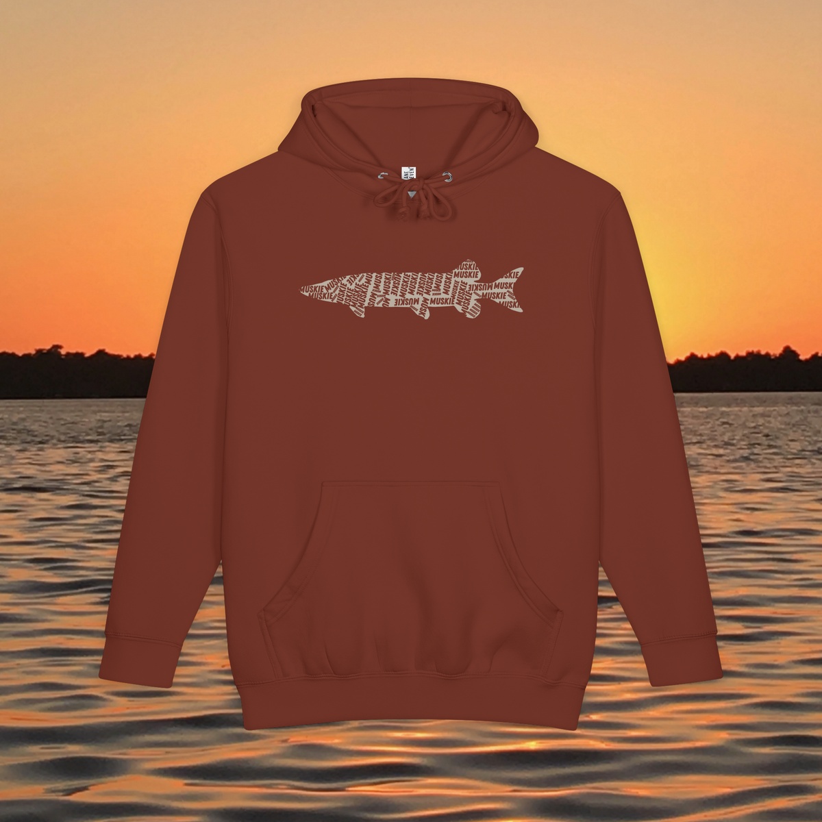 Muskie Lives Within Us black heavyweight hoodie with tan MUSKIE word art fish silhouette over sunset lake