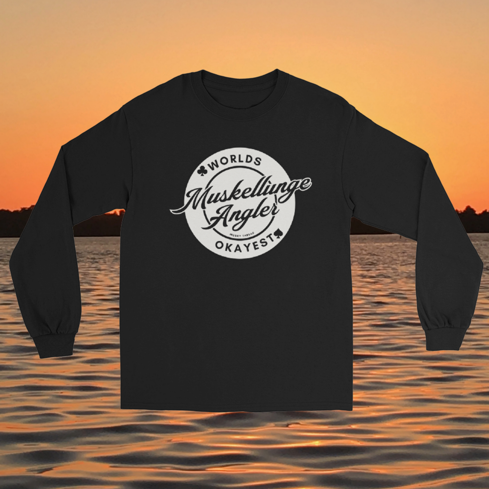 Unisex long sleeve shirt with Worlds Okayest Muskellunge Angler circular badge design, worn against a lake sunset background