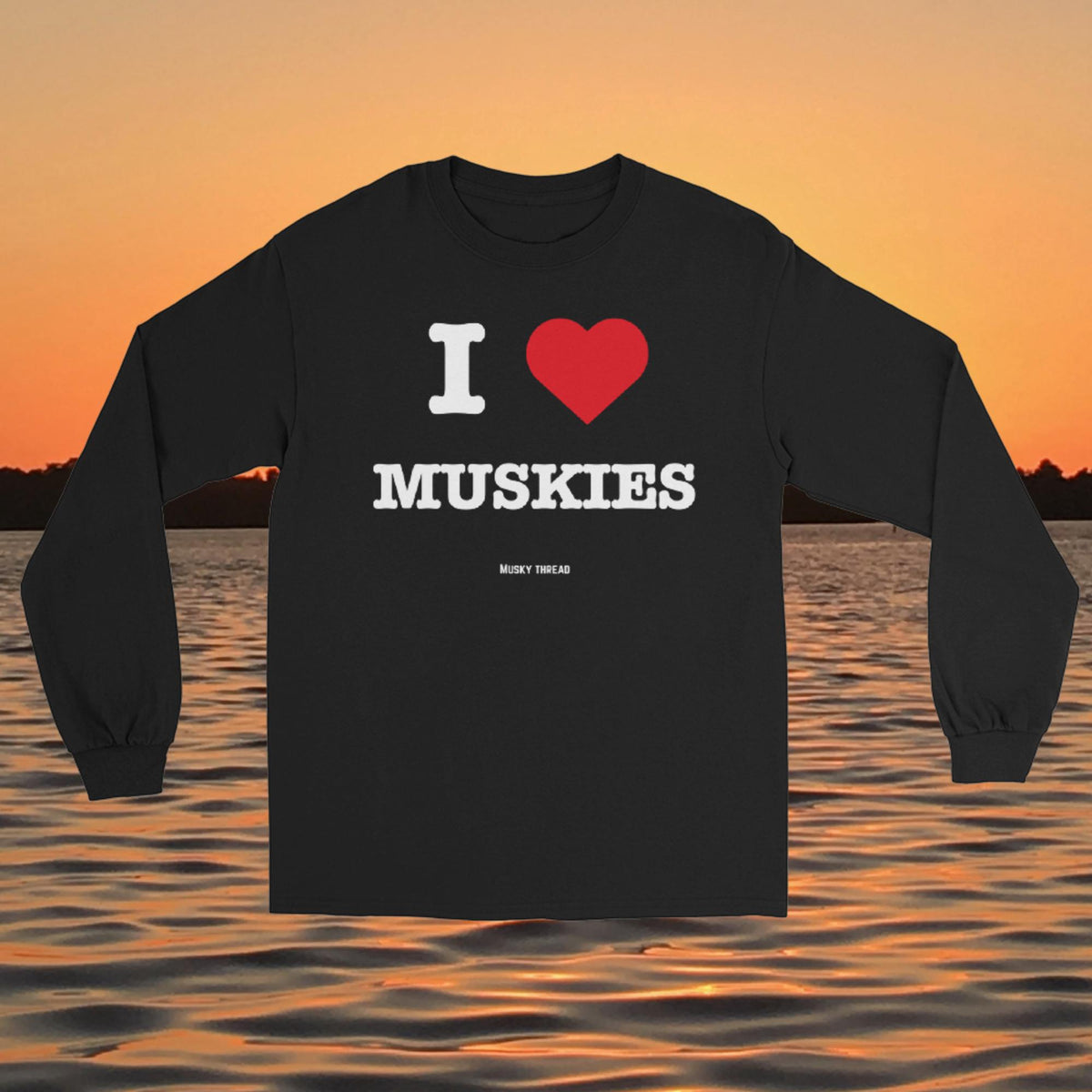 I Love Muskies long sleeve shirt with red heart design over a lake sunset