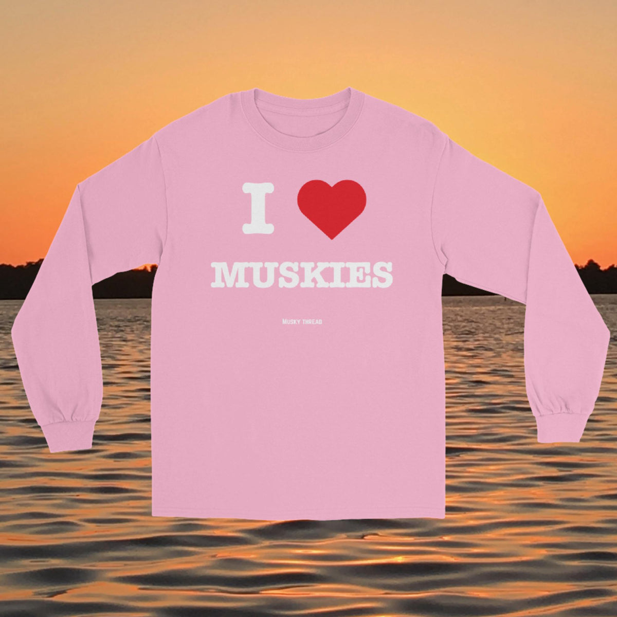 I Love Muskies long sleeve shirt with red heart design over a lake sunset