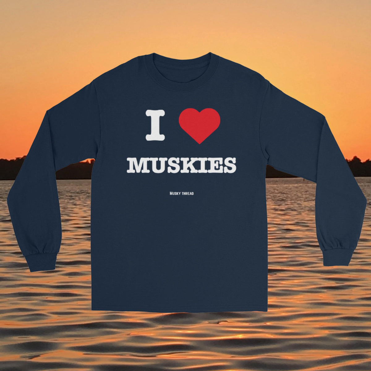 I Love Muskies long sleeve shirt with red heart design over a lake sunset