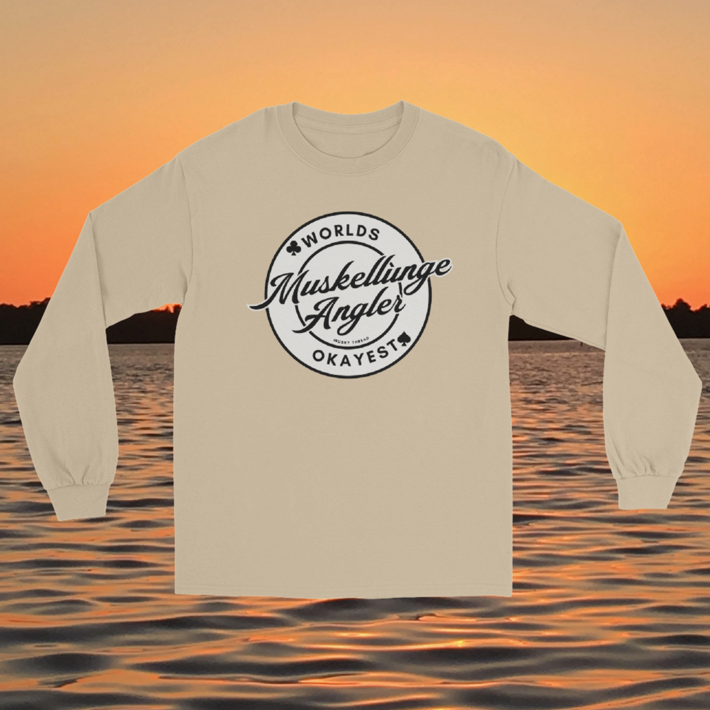 Unisex long sleeve shirt with Worlds Okayest Muskellunge Angler circular badge design, worn against a lake sunset background